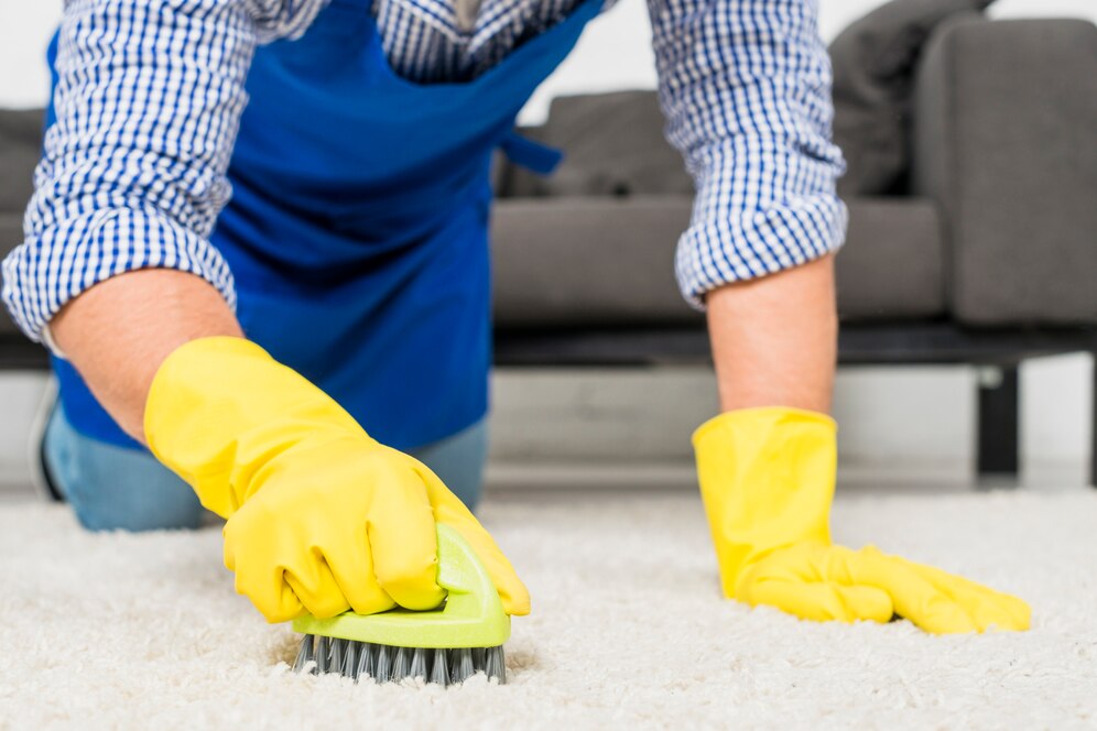 close-up-man-cleaning-his-house_23-2148112715
